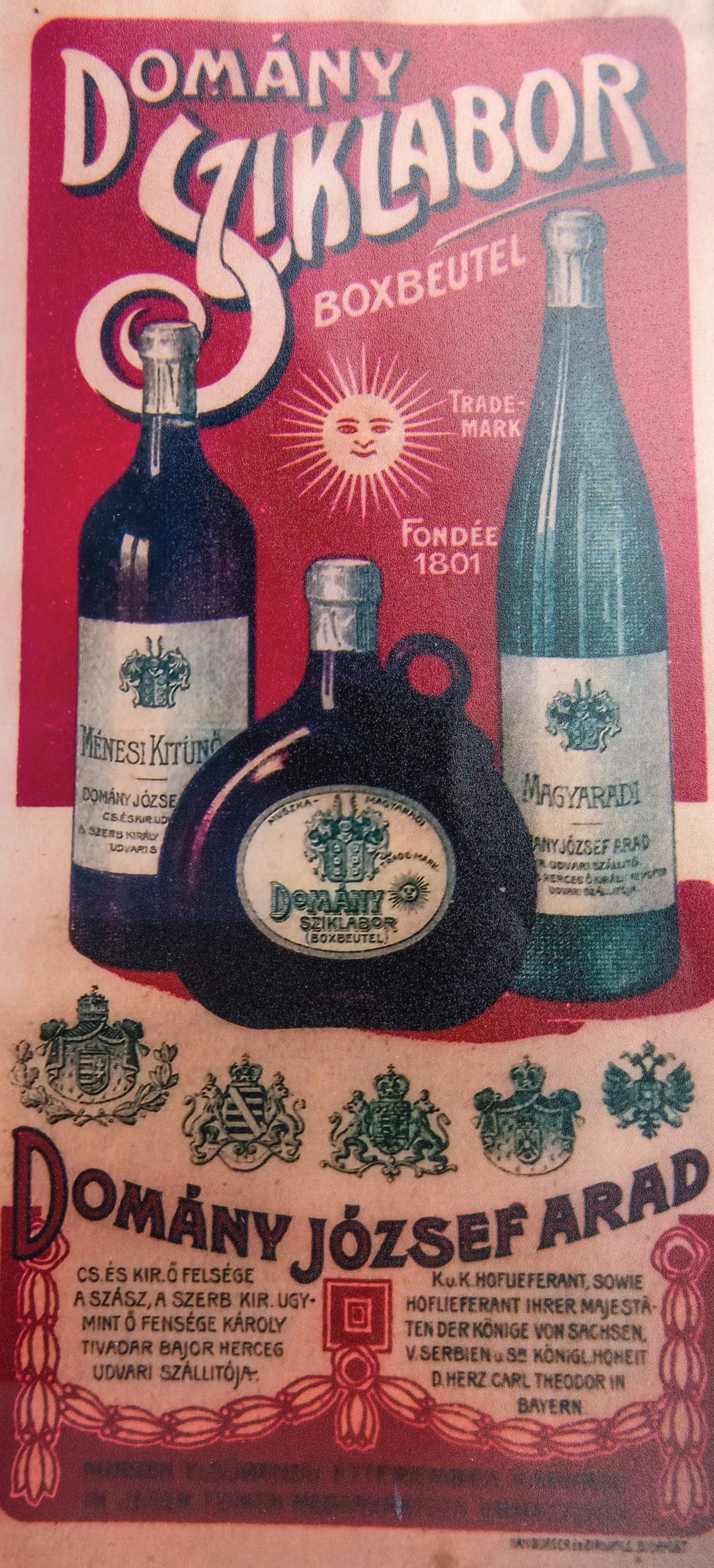 Etichetă pentru sticla de vin a comerciantului Domány József Folosite pentru vinurile de Miniș și Măderat Fondată în 1801